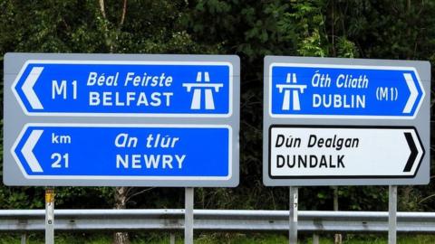 Belfast, Newry, Dublin and Dundalk directional road signs.