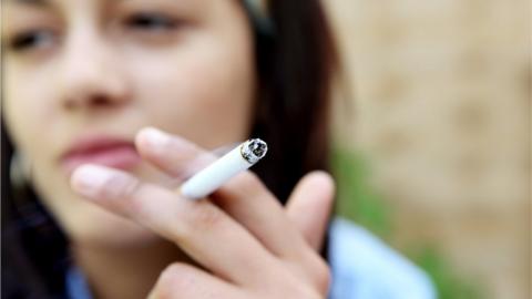 Young woman with cigarette