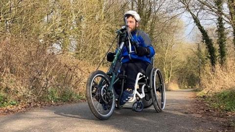 Ellis Palmer on his handcycle on the Lune Valley greenway
