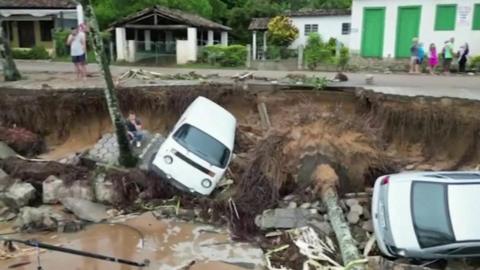 Cars pulled into earth by landslide
