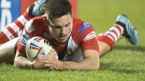 Salford Red Devils full-back Niall Evalds scores a try