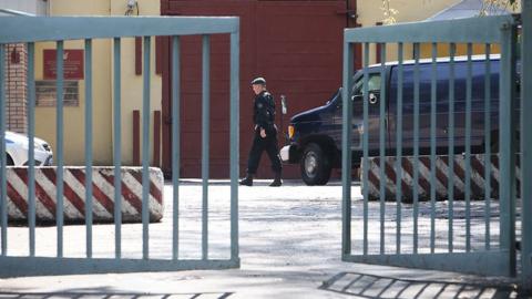 A Russian law enforcement officer walks near an entrance to the Lefortovo prison in Moscow