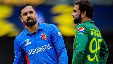 Afghanistan's Mohammad Nabi and Pakistan's Iftikhar Ahmed in 2022