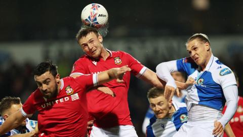 Wrexham's Sam Dalby in action against Championship club Blackburn Rovers in this season's FA Cup