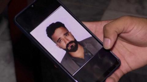 A picture of Shehryar Sultan on a mobile phone