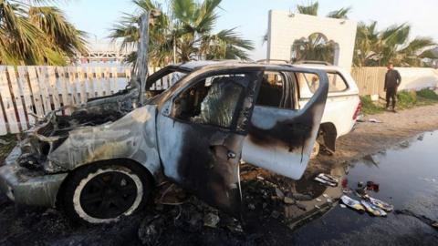 A destroyed vehicle in Gaza