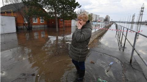 Medical worker in flooded area of Orenburg city