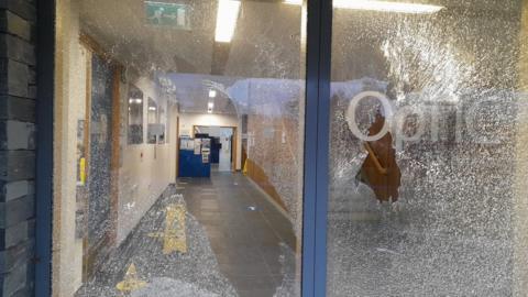 Smashed windows on the Optic Centre