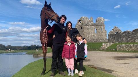 Christian Williams with wife Charlotte, daughters Betsy and Tilly and Scottish Grand National winner, Kitty's Light
