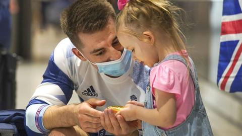 Max Whitlock and daughter at Heathrow Airport