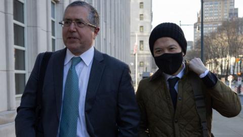 Lawyer Marc Agnifilo (L) and former Goldman Sachs banker Roger Ng (R) arrive at the US Federal Court.