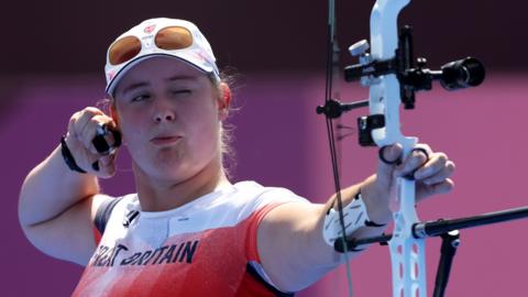 Phoebe Paterson Pine shoots an arrow at the Tokyo Paralympics