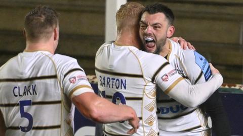 Jake Morris (right) celebrates his try against Newcastle Falcons with his Gloucester team-mates