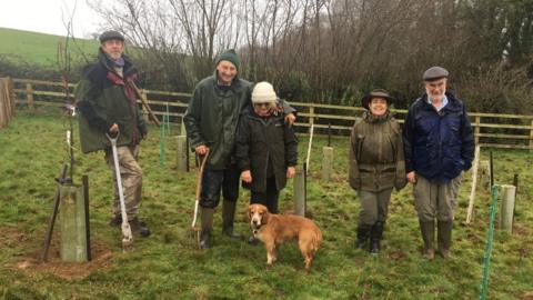 Members of the Ilminster Tree Project planting some trees