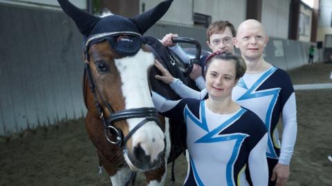 Antinisca, Alberto and Michele standing by the side of a horse