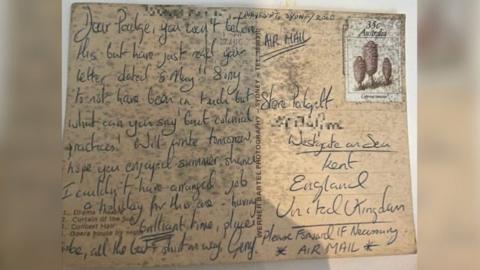Handwritten message on postcard