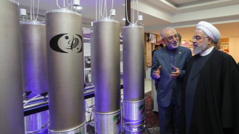 Iranian President Hassan Rouhani is shown nuclear technology by Ali Akbar Salehi, head of Atomic Energy Organization of Iran (9 April 2019)