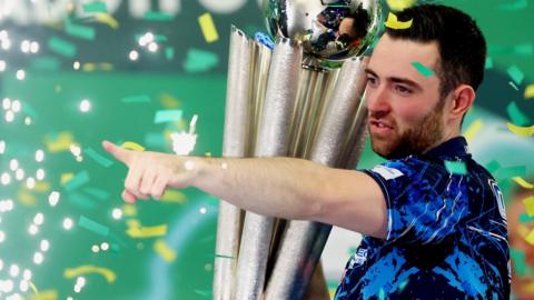 Luke Humphries celebrates winning the PDC World Darts Championship