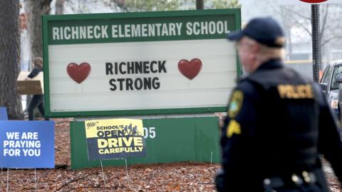 Police officer outside Richneck Elementary School on 30 January