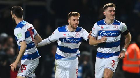 QPR players celebrate a goal against West Brom