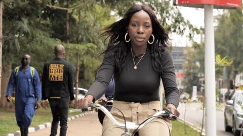 A woman riding a bike in Kigali