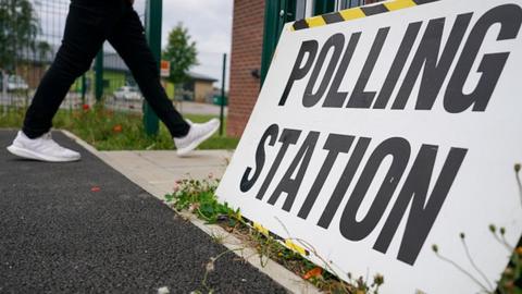 A photo of a polling station sign