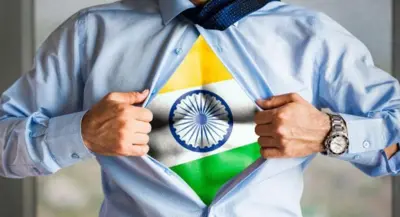 The flag of India bursting out of a shirt a man is wearing
