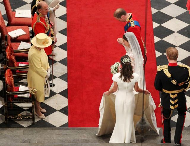Prince William and his new bride Kate bow in front of Queen Elizabeth II at Westminster Abbey