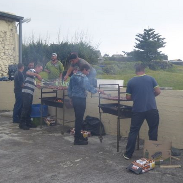 Men with barbeques