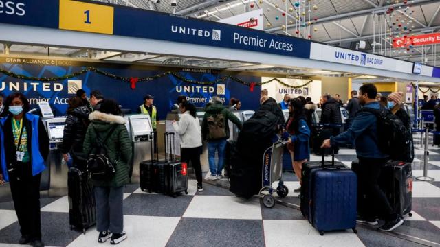 Passengers check into their flights at O'Hare International Airport, Chicago