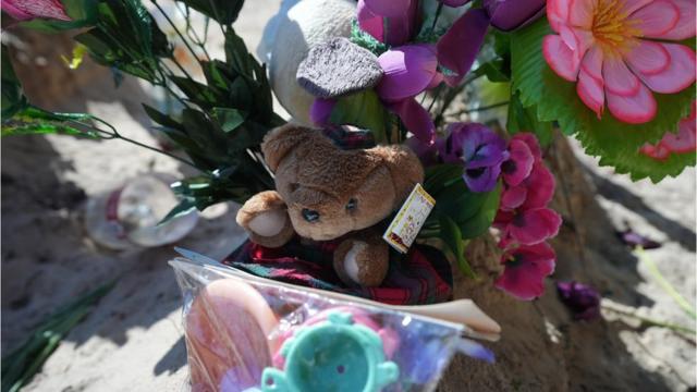 Ivan's daughter's toys on her grave