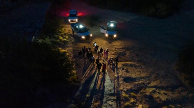Migrants from Central and South America are registered by border patrol agents in Roma, Texas, having crossed the Rio Grande river into the United States from Mexico - 13 June 2022.