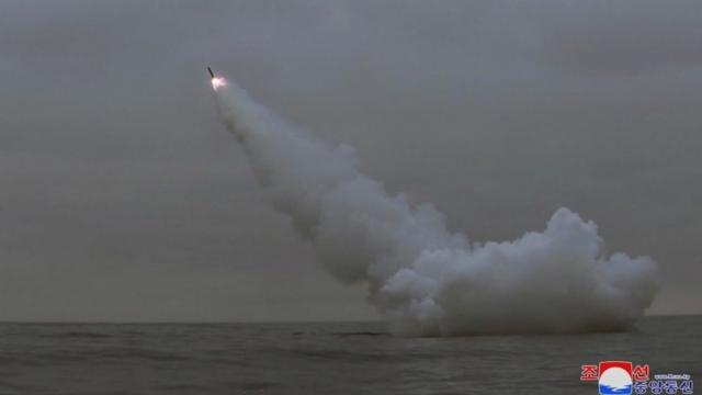 A missile heads towards the sky after being fired from under water