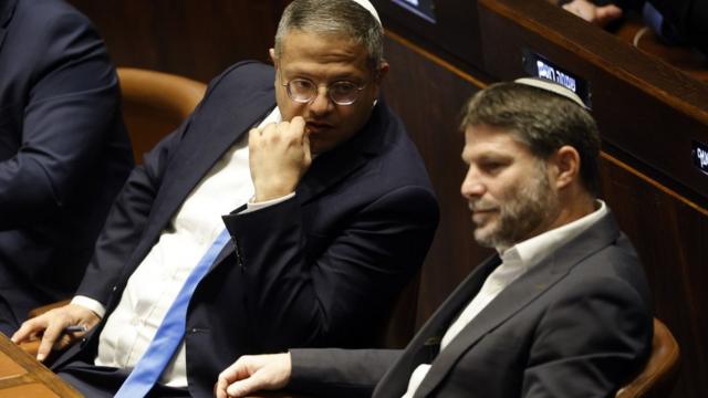 Otzma Yehudit (Jewish Power) party leader Itamar Ben-Gvir (L) and Religious Zionism leader Bezalel Smotrich (R) attend a special session of the Israeli Knesset in Jerusalem on 29 December 2022