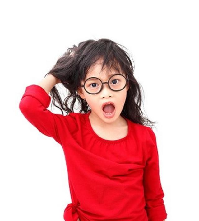 A little Chinese girl - with red top and black-rimmed glasses - scratching her head