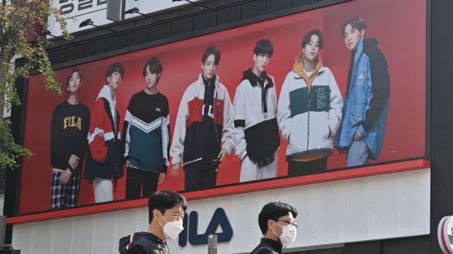 BTS на рекламном постере спортивного бренда