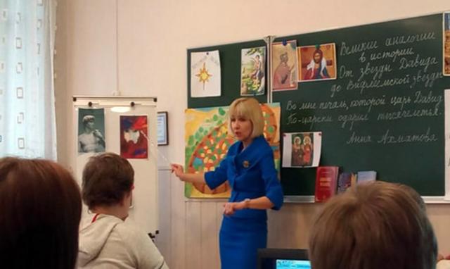 Oksana at work as a religious studies teacher