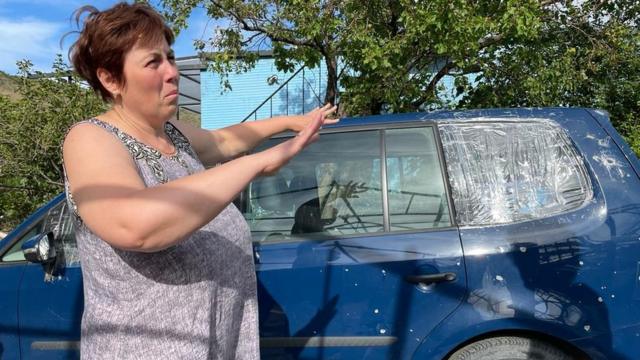 Natasha shows damage to cars driven from Mariupol to Georgia