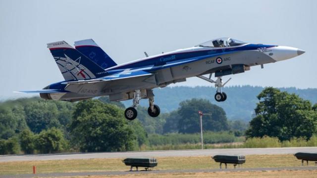 A Canadian Air Force twin tailed fighter jet, CF-18 Hornet landing at an air show