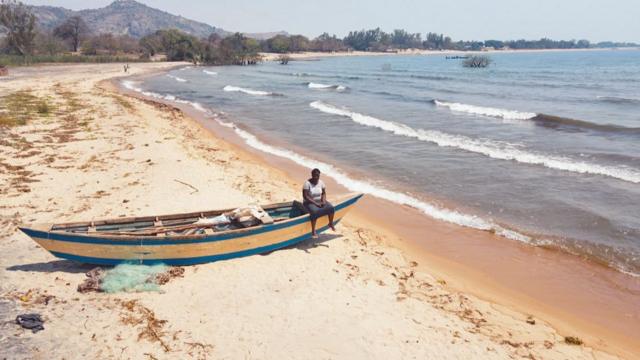 Georgina in a boat on by Lake Malawi