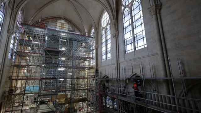 Workers inside Notre-Dame cathedral