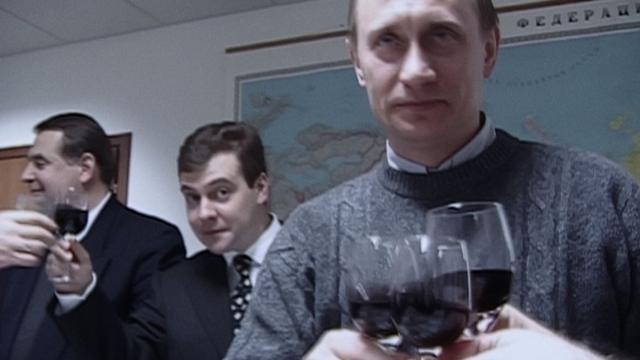 Празднование победы в избирательном штабе Путина. За спиной новоизбранного президента - глава штаба Дмитрий Медведев