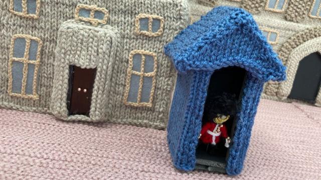 Knitted soldier in sentry box
