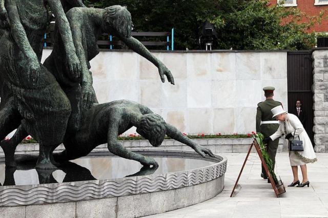 Queen Elizabeth II lays a wreath at the Garden of Remembrance