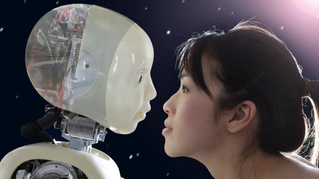 A woman staring into a robot's eyes