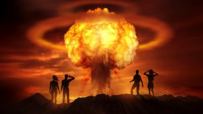 Two couples stare at a mushroom cloud