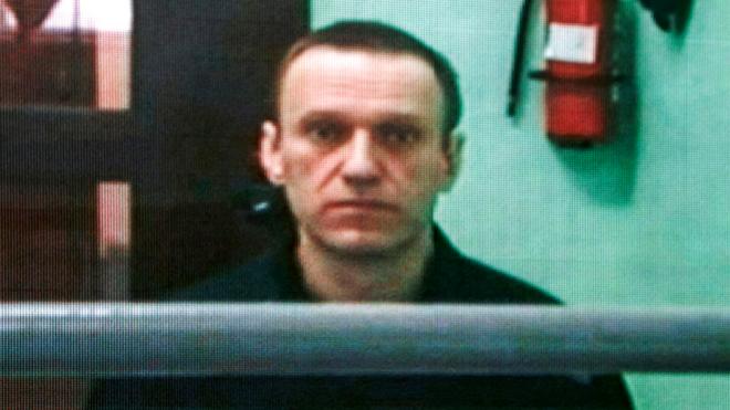 Jailed Russian opposition figure Alexei Navalny appears on a screen via a video link from his penal colony during court hearings in Moscow, 22 June 2023