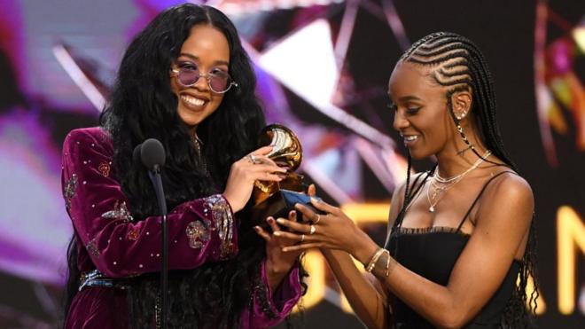 H.E.R. and Tiara Thomas accept the Song of the Year award for 'I Can't Breathe' onstage during the 63rd Annual GRAMMY Awards at Los Angeles Convention Center on March 14, 2021 in Los Angeles, California. (Photo by Kevin Winter/Getty Images for The Recording Academy)