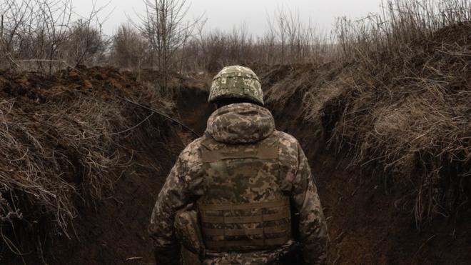 A Ukrainian soldier is seen outside Svitlodarsk, Ukraine, 12 February 2022