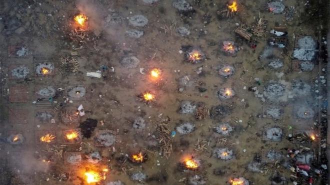 A mass cremation of victims who died due to the coronavirus disease (COVID-19), is seen at a crematorium ground in New Delhi, India, April 22, 2021.